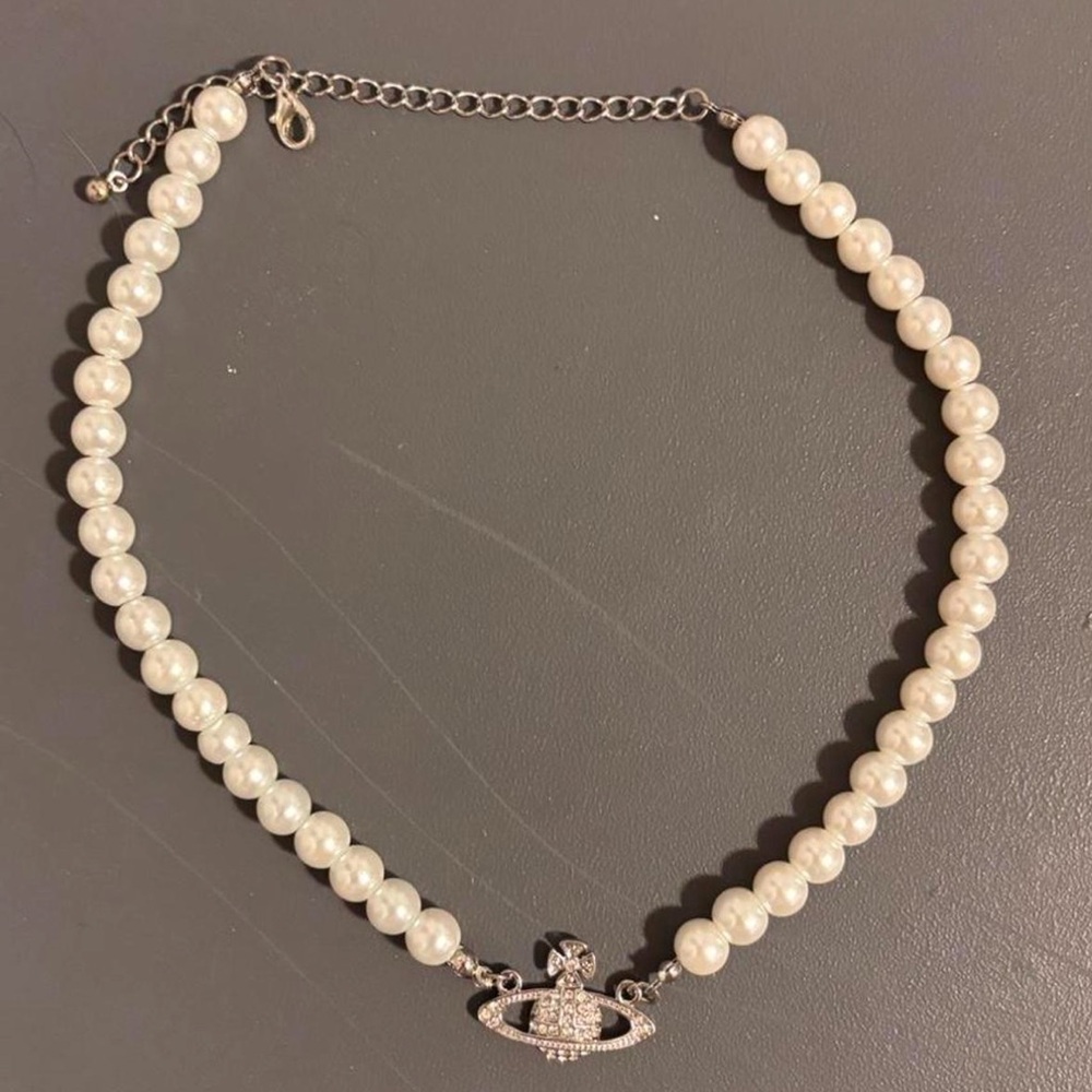 Elegant Pearl Necklace with Silver Saturn